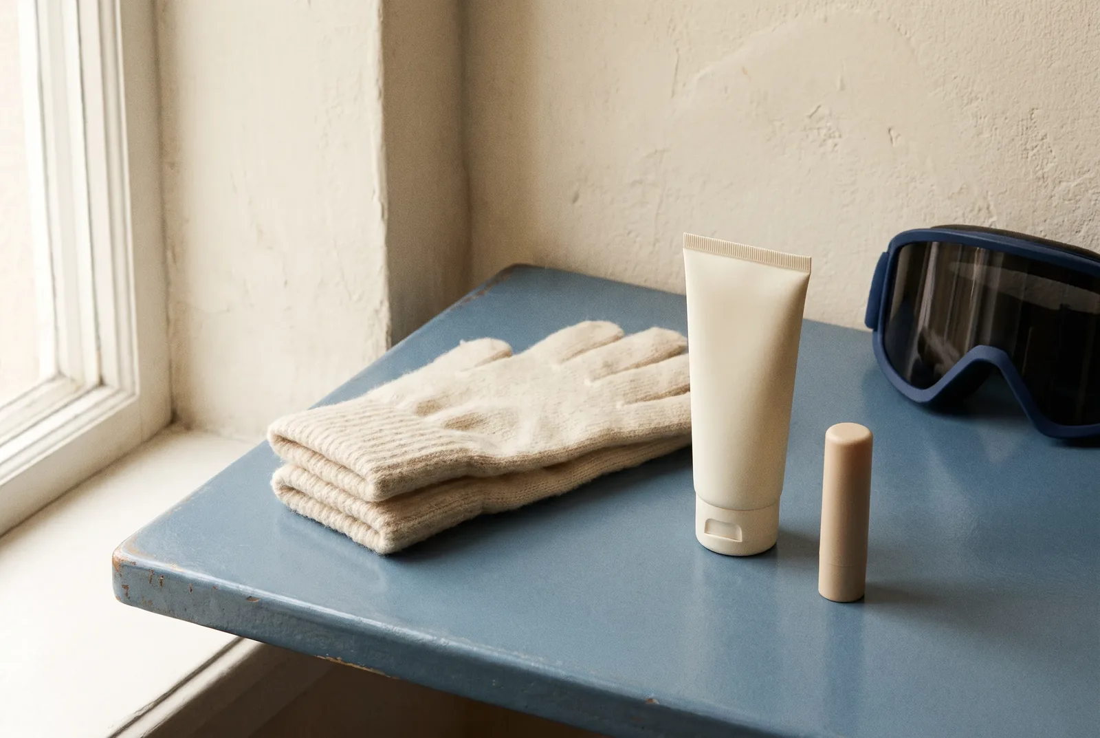 Guantes, gafas de esquí y productos de protección de la piel